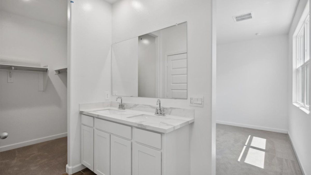 Owner’s ensuite adds stylish appeal, spa-inspired design, adds walk-in shower, double vanity, walk-in closet access