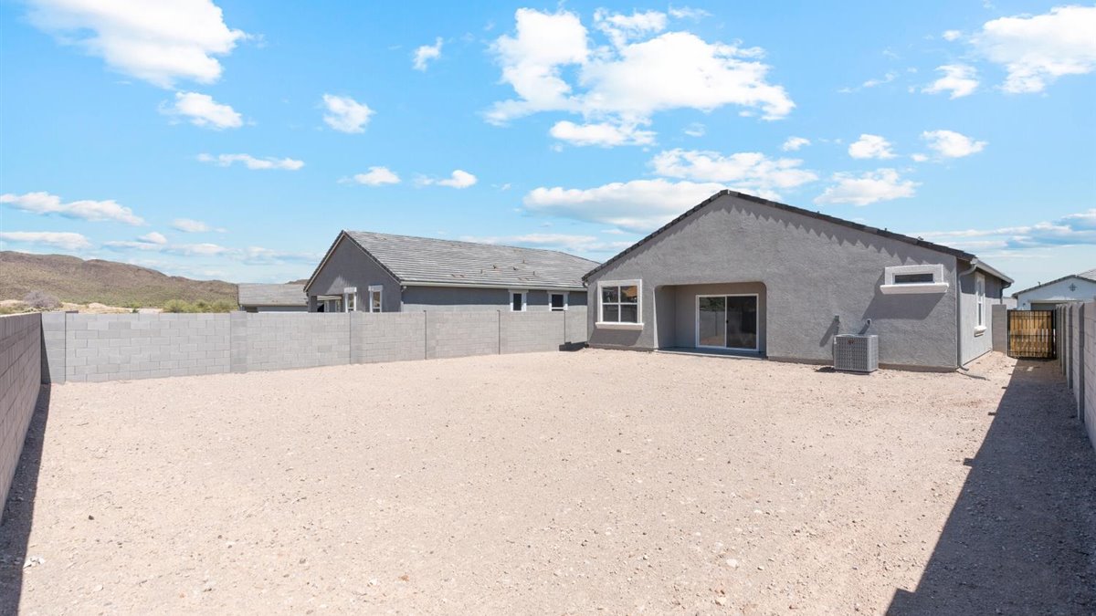 Backyard with concrete patio for grill setup, smooth indoor-outdoor transition, outdoor fun