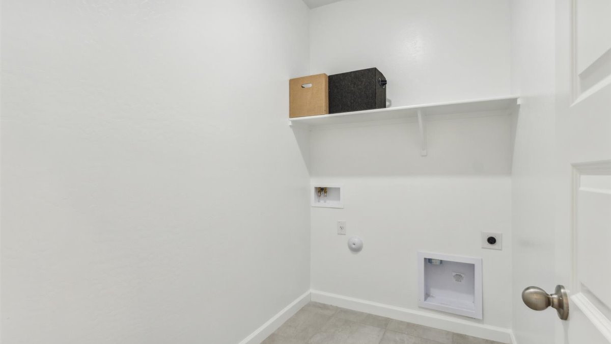 laundry room with shelving
