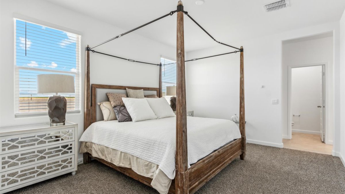Camden bedroom with windows and carpet flooring