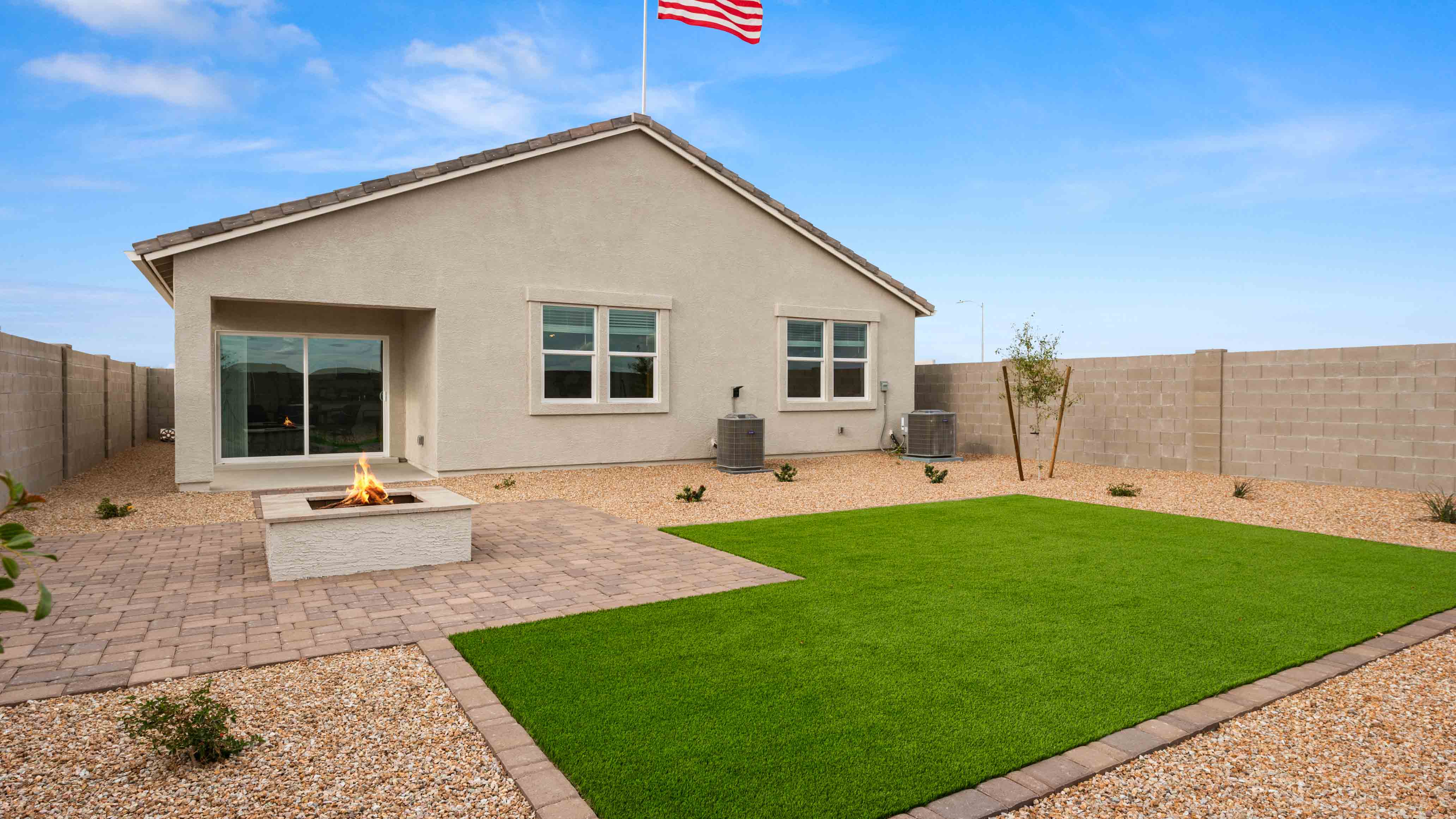 Large fenced-in backyard with a covered patio, perfect for outdoor entertaining.