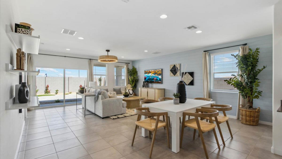 Kingston dining room and great room with a sliding glass door to the backyard
