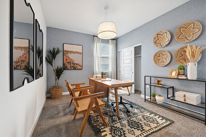 A tidy office featuring a desk, chair, and a window, creating a bright and organized workspace.