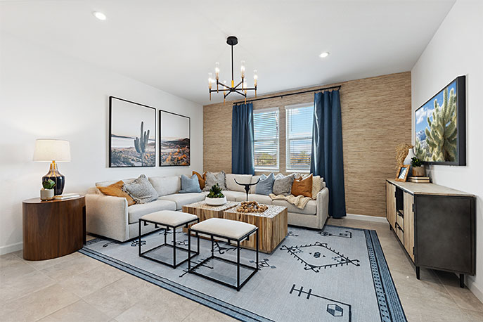 A well-organized living room that includes a kitchen and dining area, creating a warm and welcoming environment for gatherings.