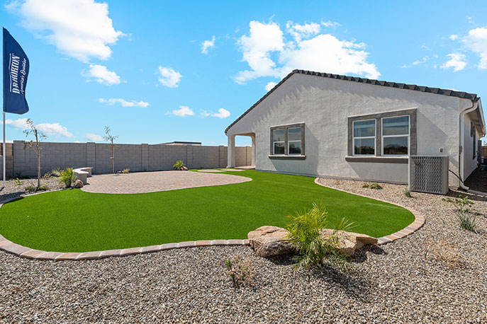 Large fenced-in backyard with a covered patio, perfect for outdoor entertaining.