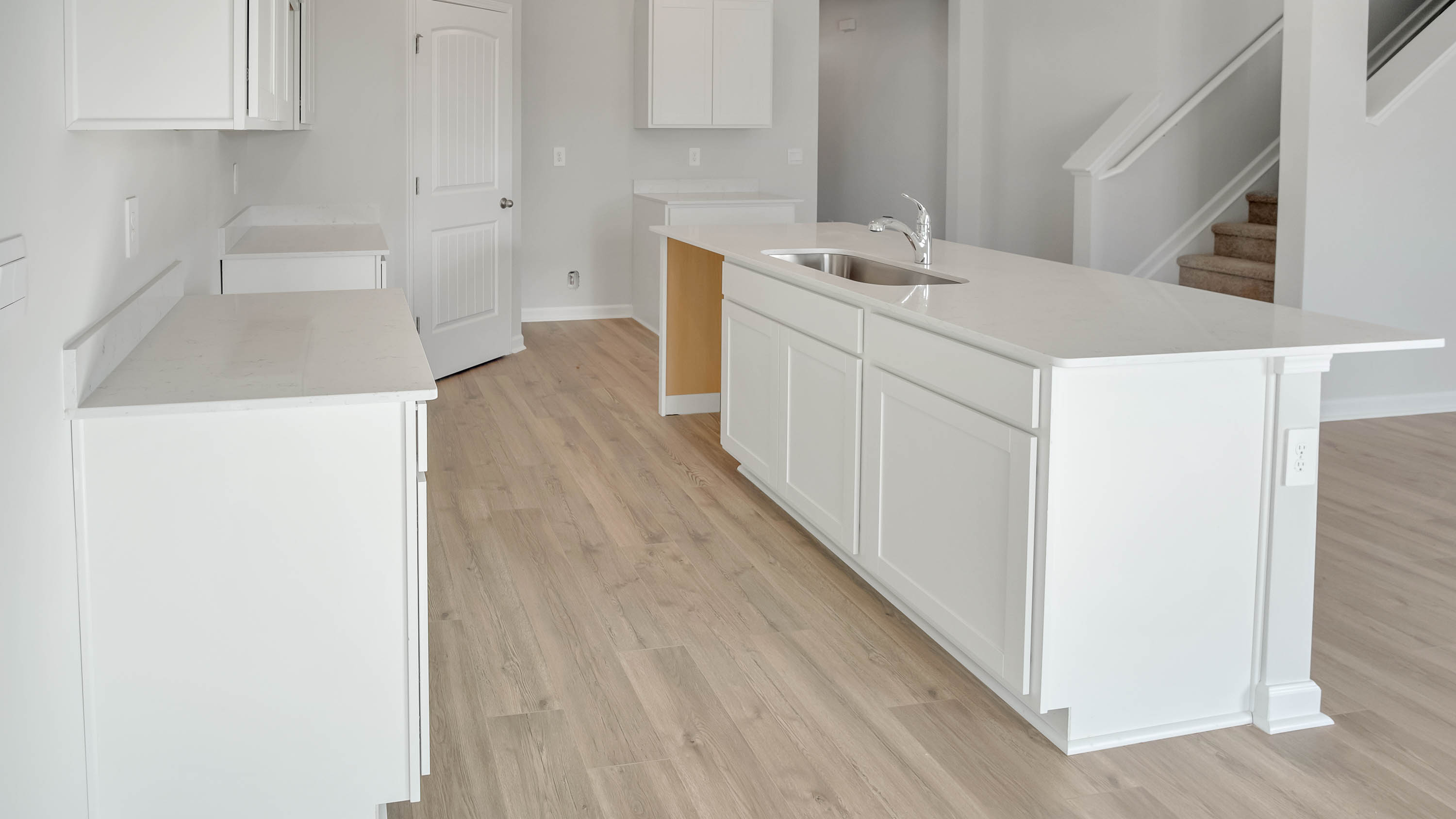 Modern kitchen with quartz countertops and stainless steel appliances