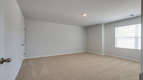 Bedroom in modern, open concept new home