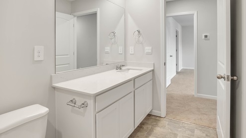 Bathroom with quartz countertops in new home