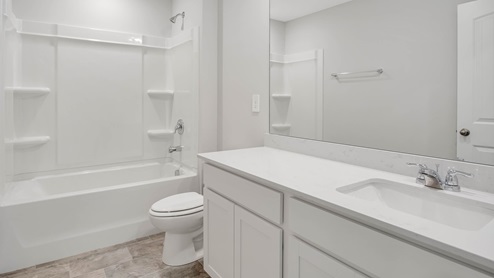 Bathroom with quartz countertops in new home