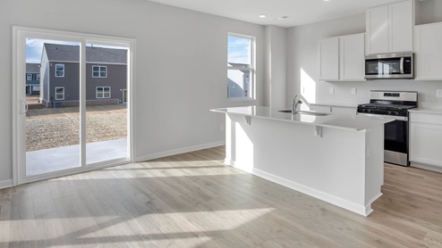 Modern kitchen with quartz countertops and stainless steel appliances