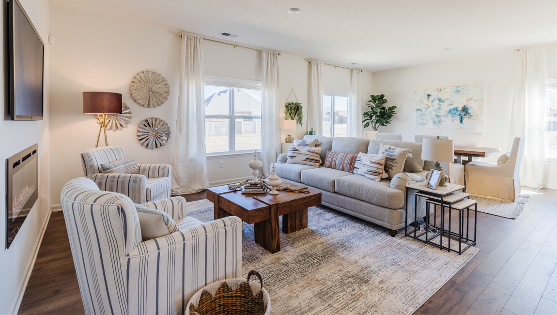 Dining room in new, open-concept home with windows and natural lighting