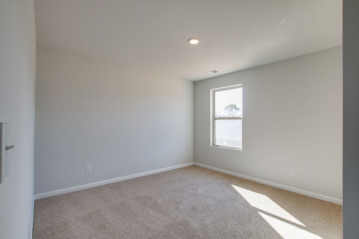 Bedroom in modern, two-story new home