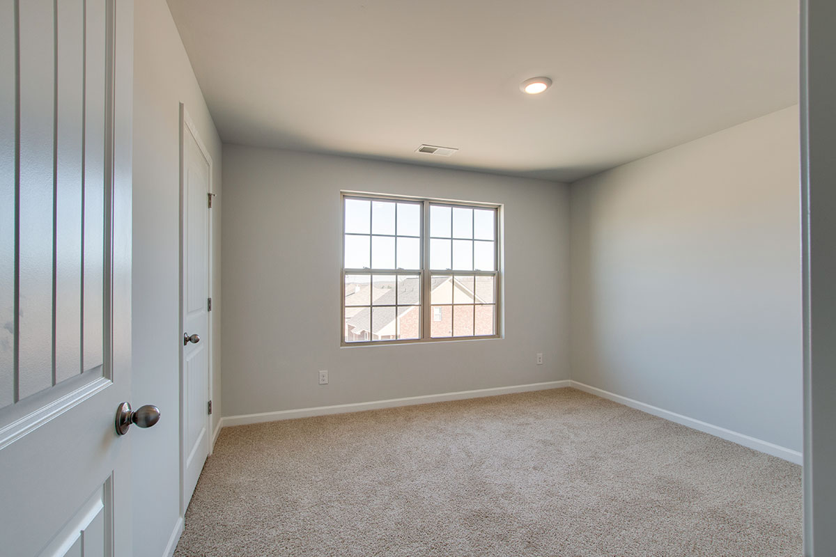 Bedroom in modern, two-story new home