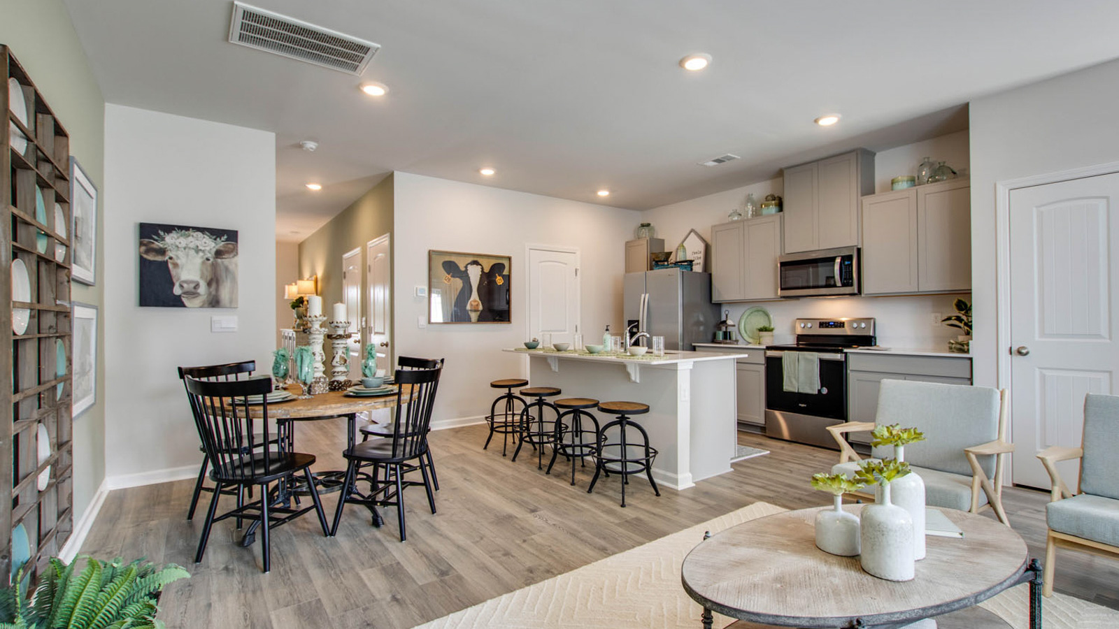 Front door view from entry to living space, next to dining and kitchen adding home connectivity showcasing River Landing