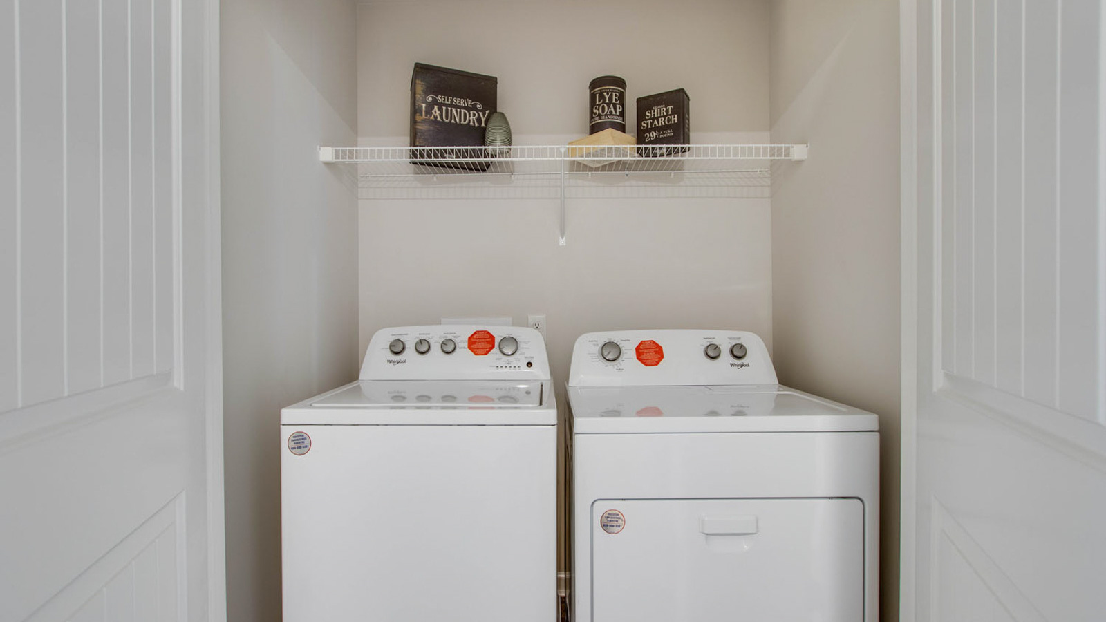 River Landing utility laundry smartly designed with overhead organized storage, a drop zone, with new washer, dryer included