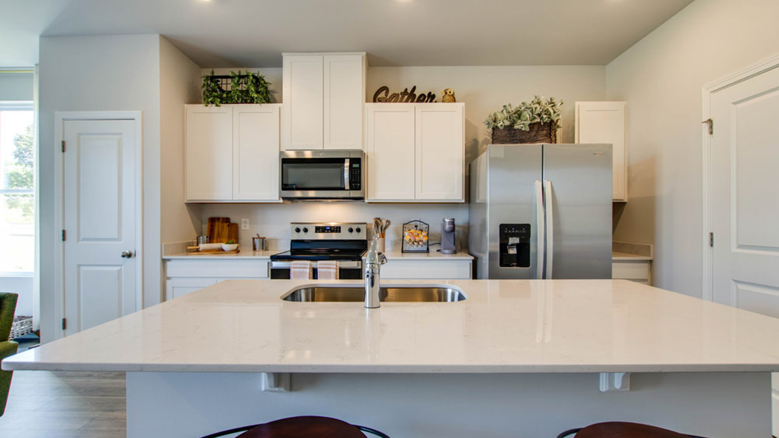 Central kitchen island with sink, seating, crafted to anchor the home, pantry, prep zones, perfect for entertaining and everyday gathering