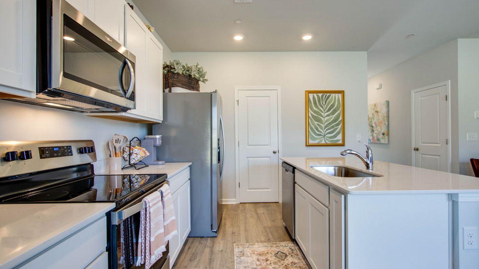 Central kitchen island with sink, seating, crafted to anchor the home, pantry, prep zones, perfect for entertaining and everyday gathering