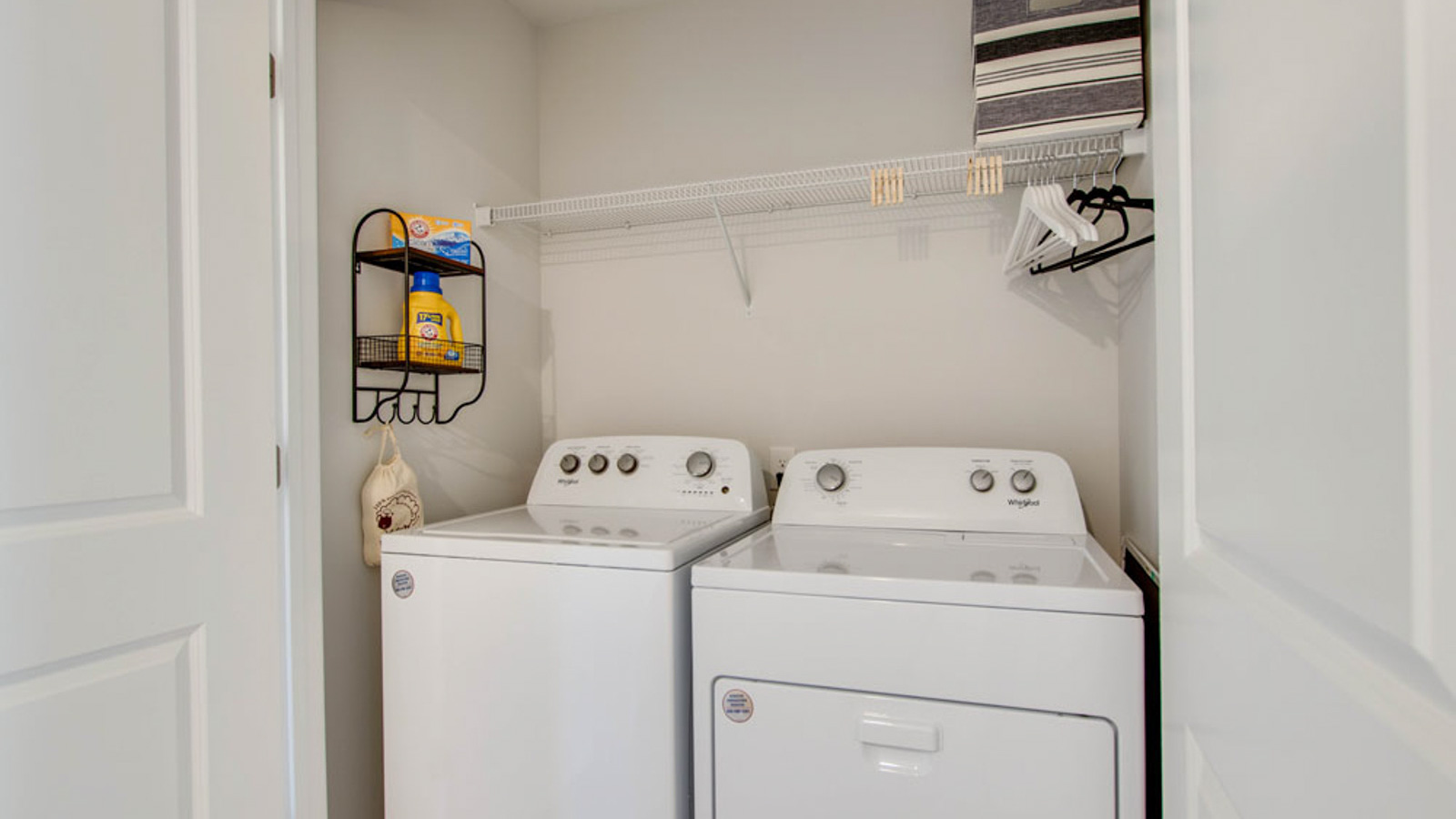 River Landing utility laundry smartly designed with overhead organized storage, a drop zone, with new washer, dryer included