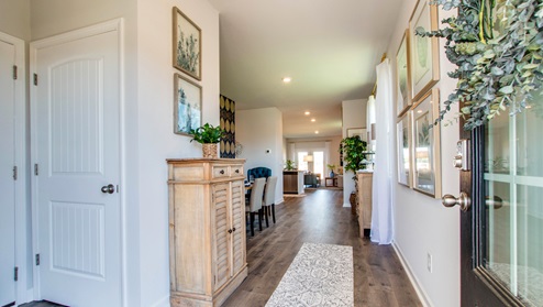 Front entryway of home with light brown flooring,