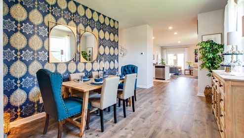 Dining area with windows for natural lighting.