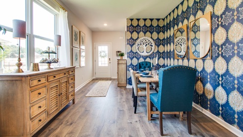 Dining area with windows for natural lighting.