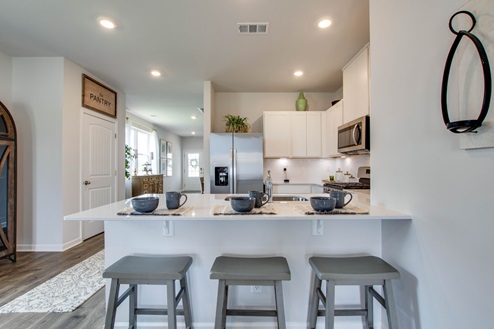 Kitchen with room for barstools.