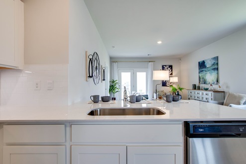 Open concept kitchen with view of living room.