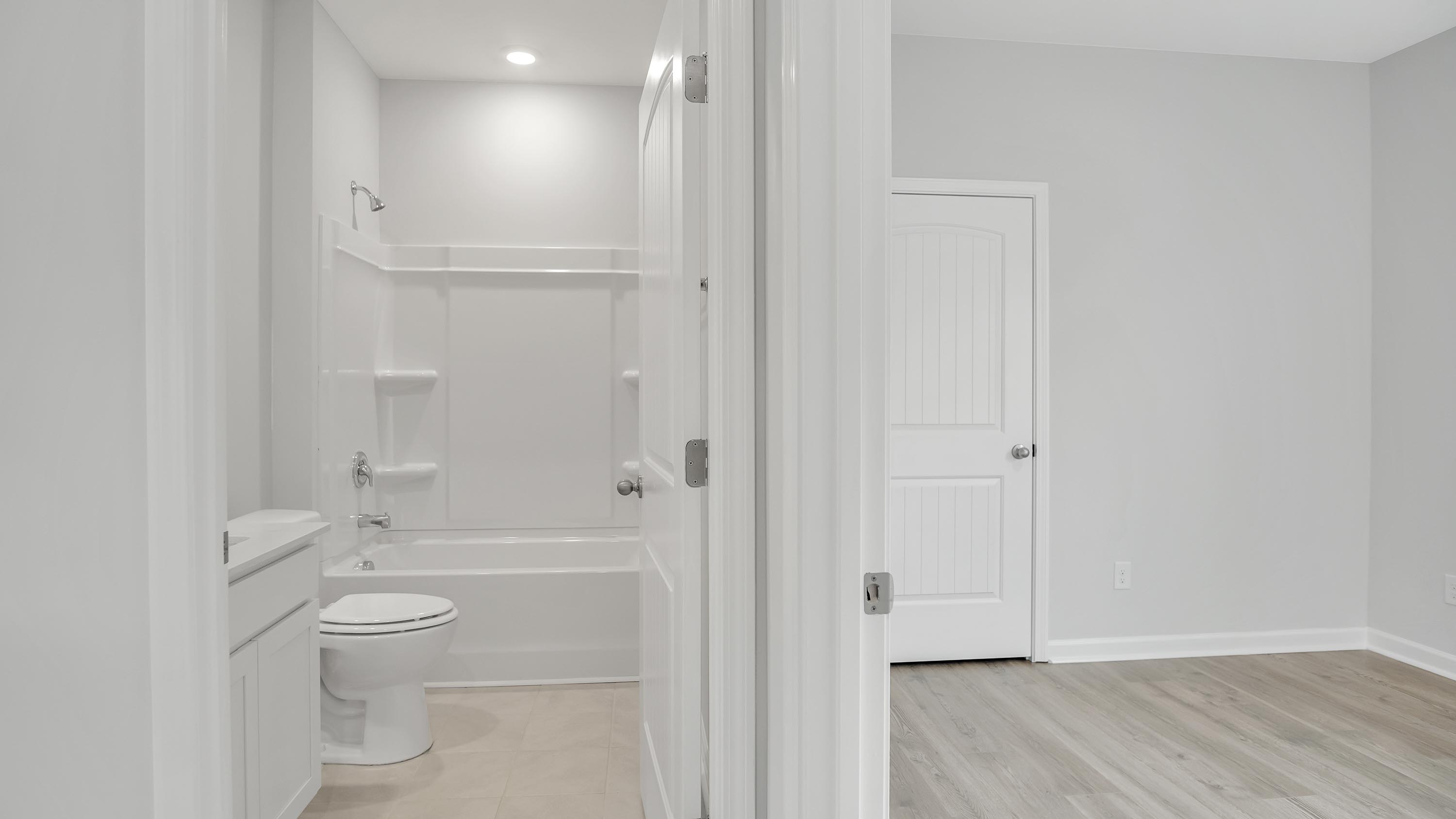 Bedroom with quartz countertop bath attached