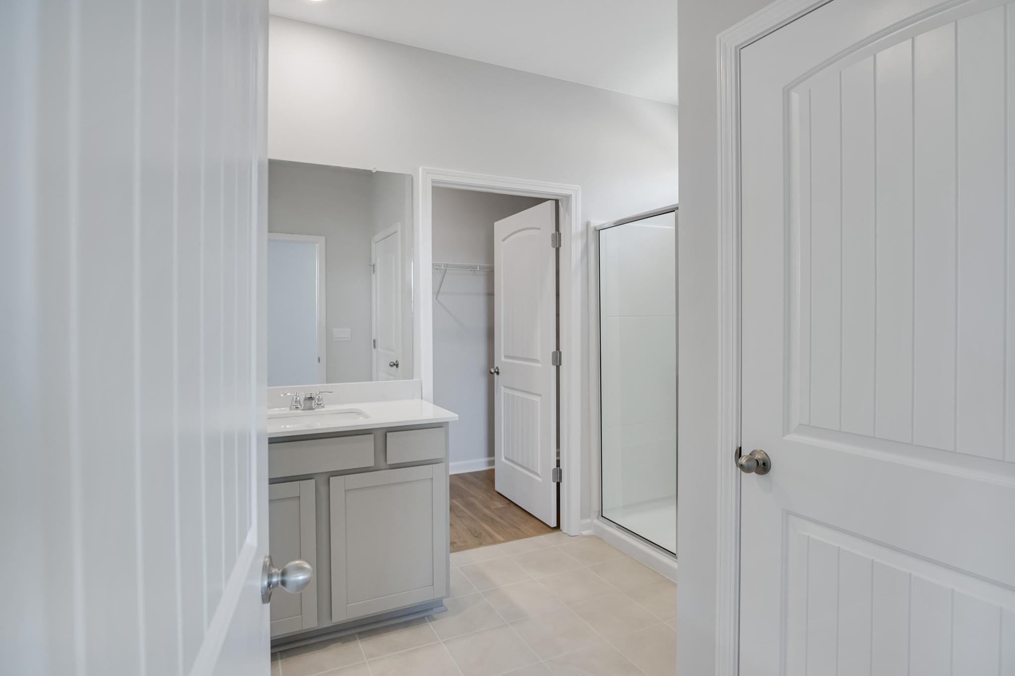 Bathroom with tile flooring.