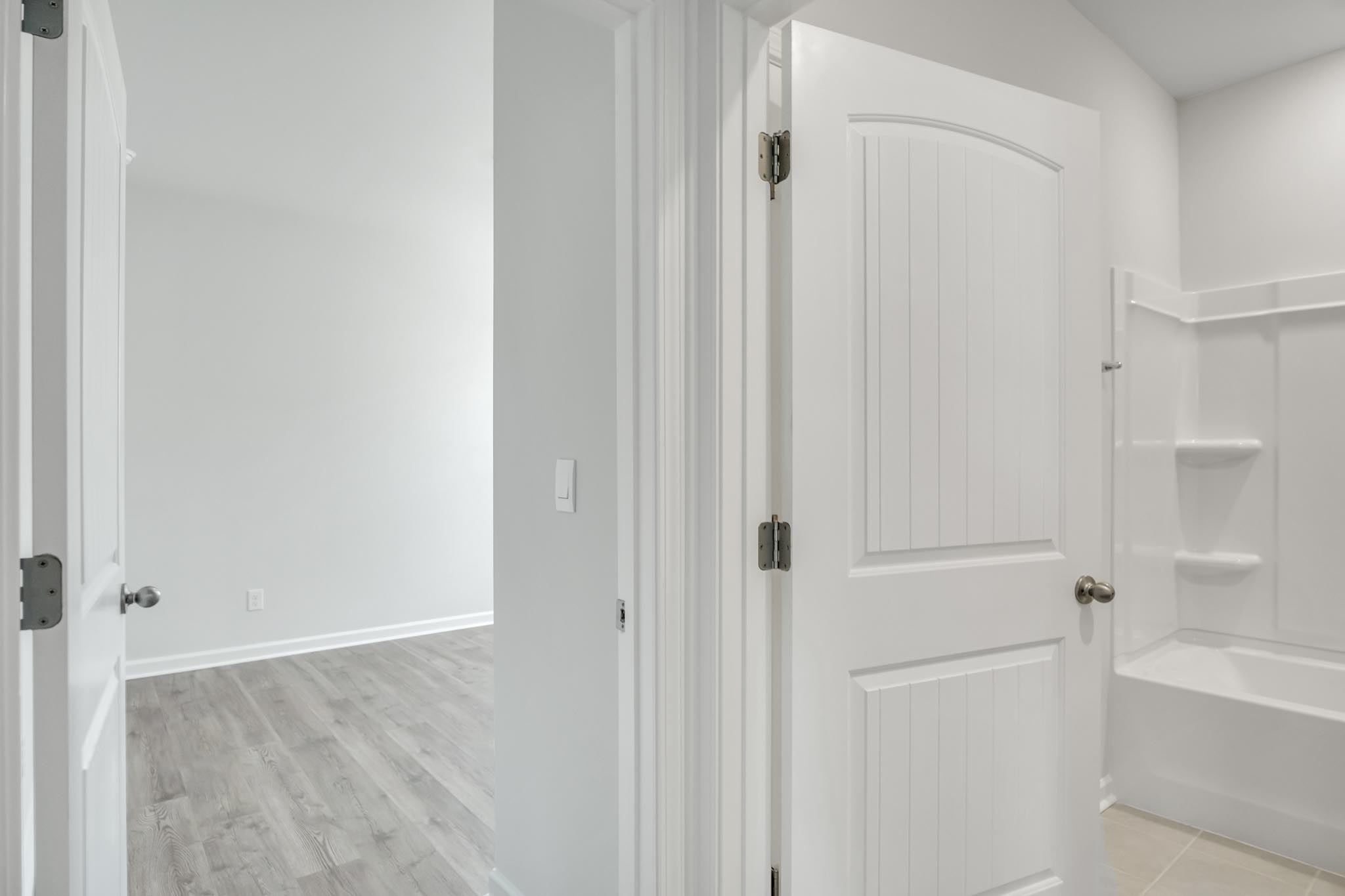 Bathroom with step in shower.