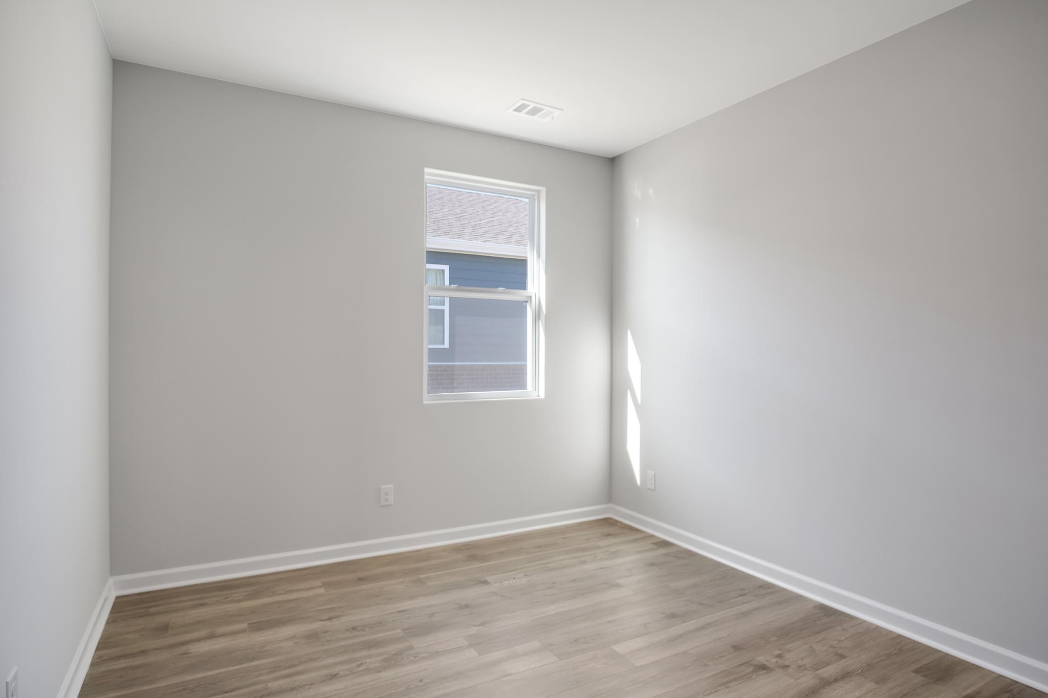 Bedroom with window for natural lighting,