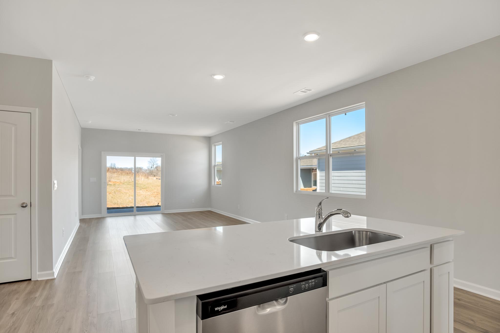 Open concept kitchen with view of living room.