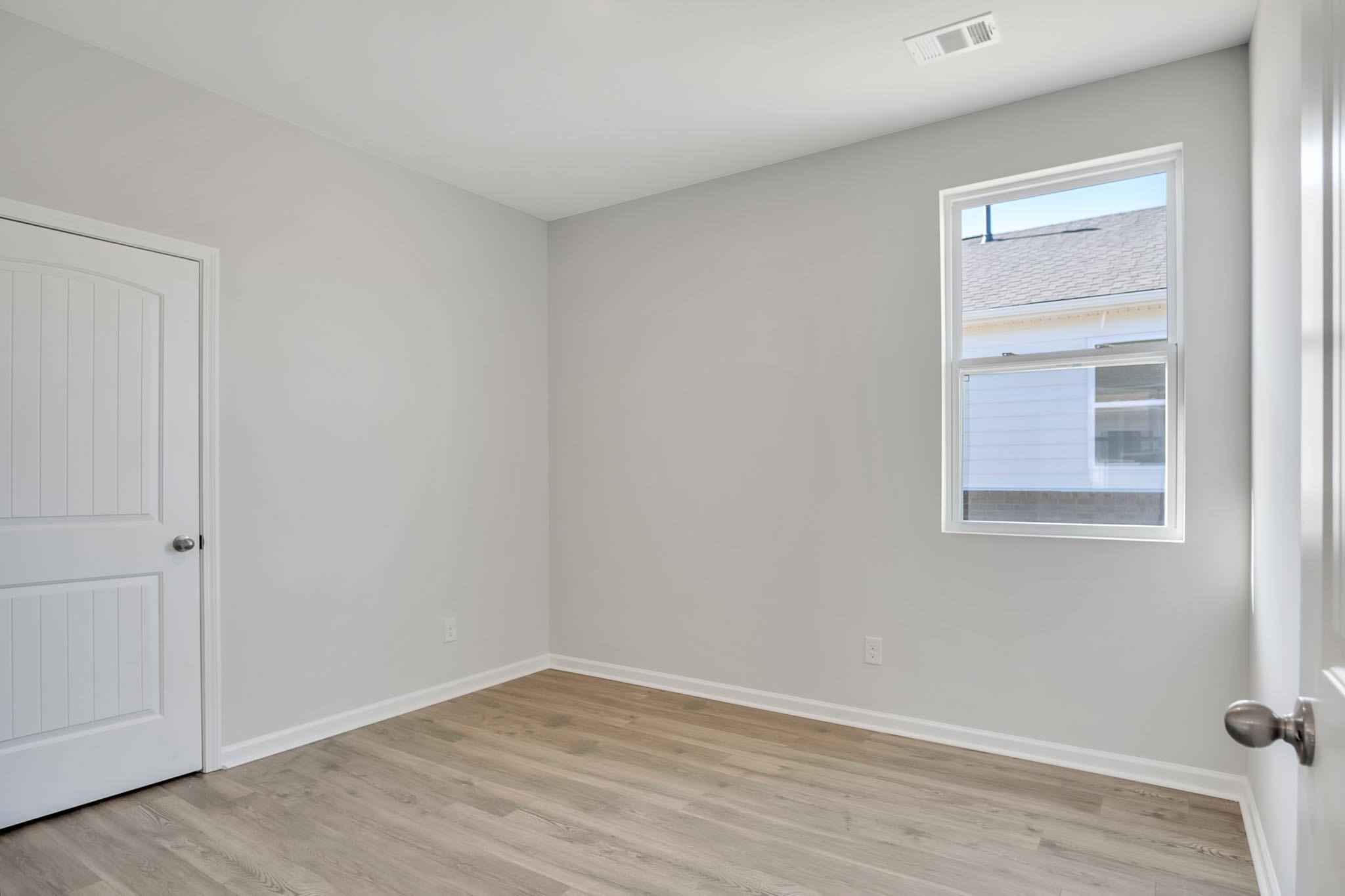 Bedroom with window for natural lighting.