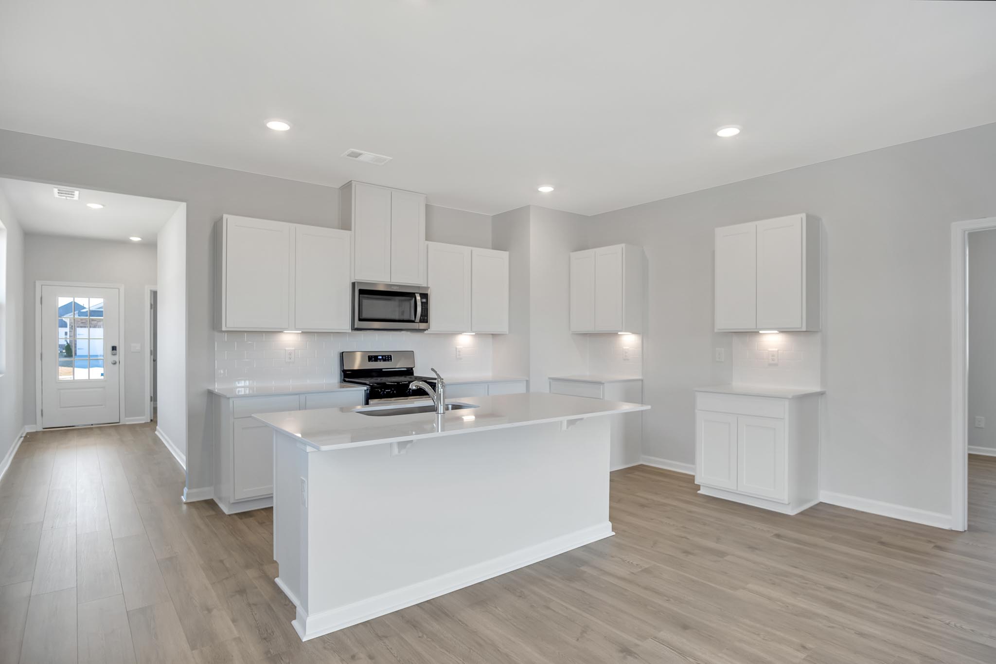 Kitchen with white cabinetry.