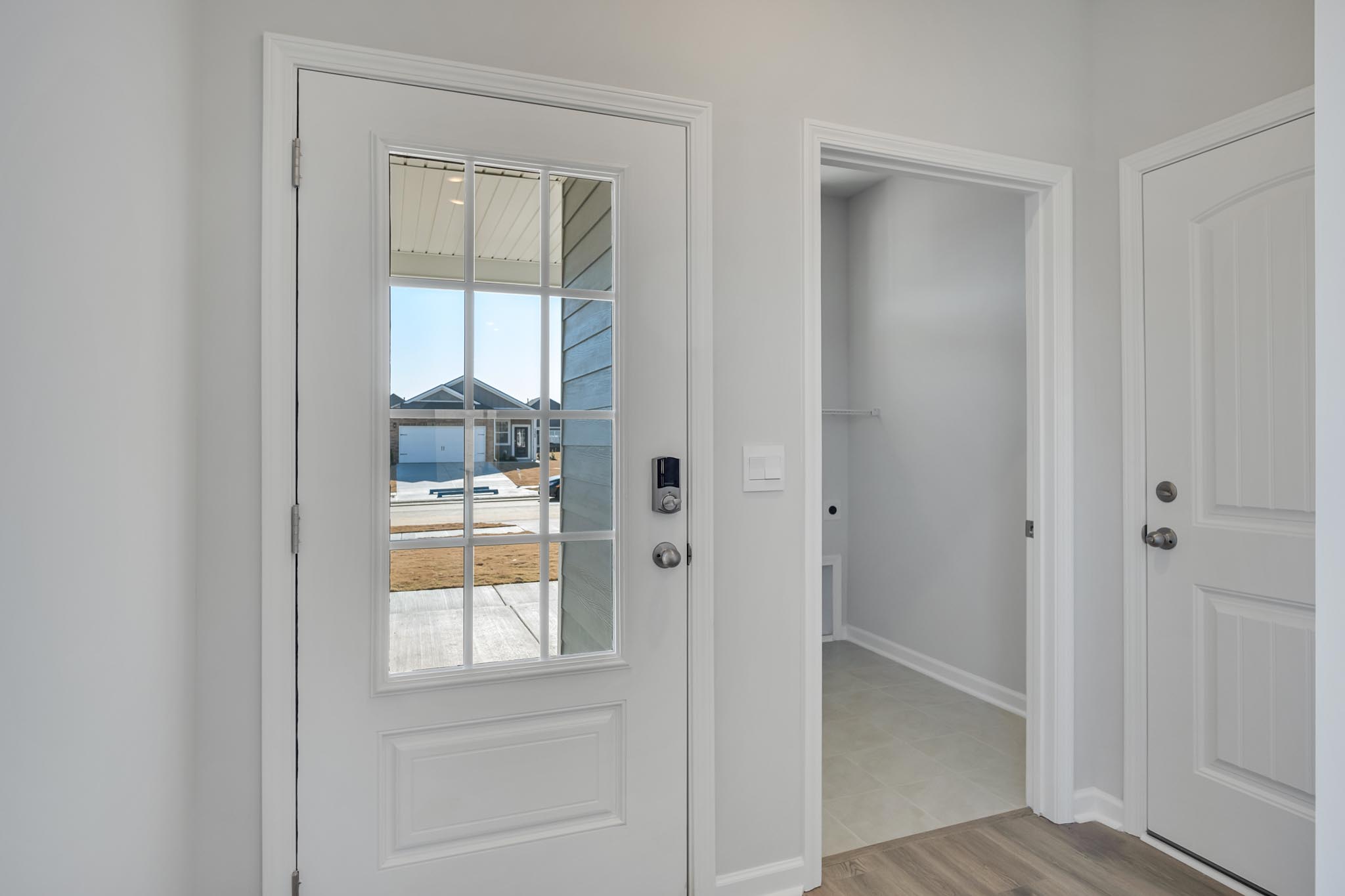 Front door with glass window planes.