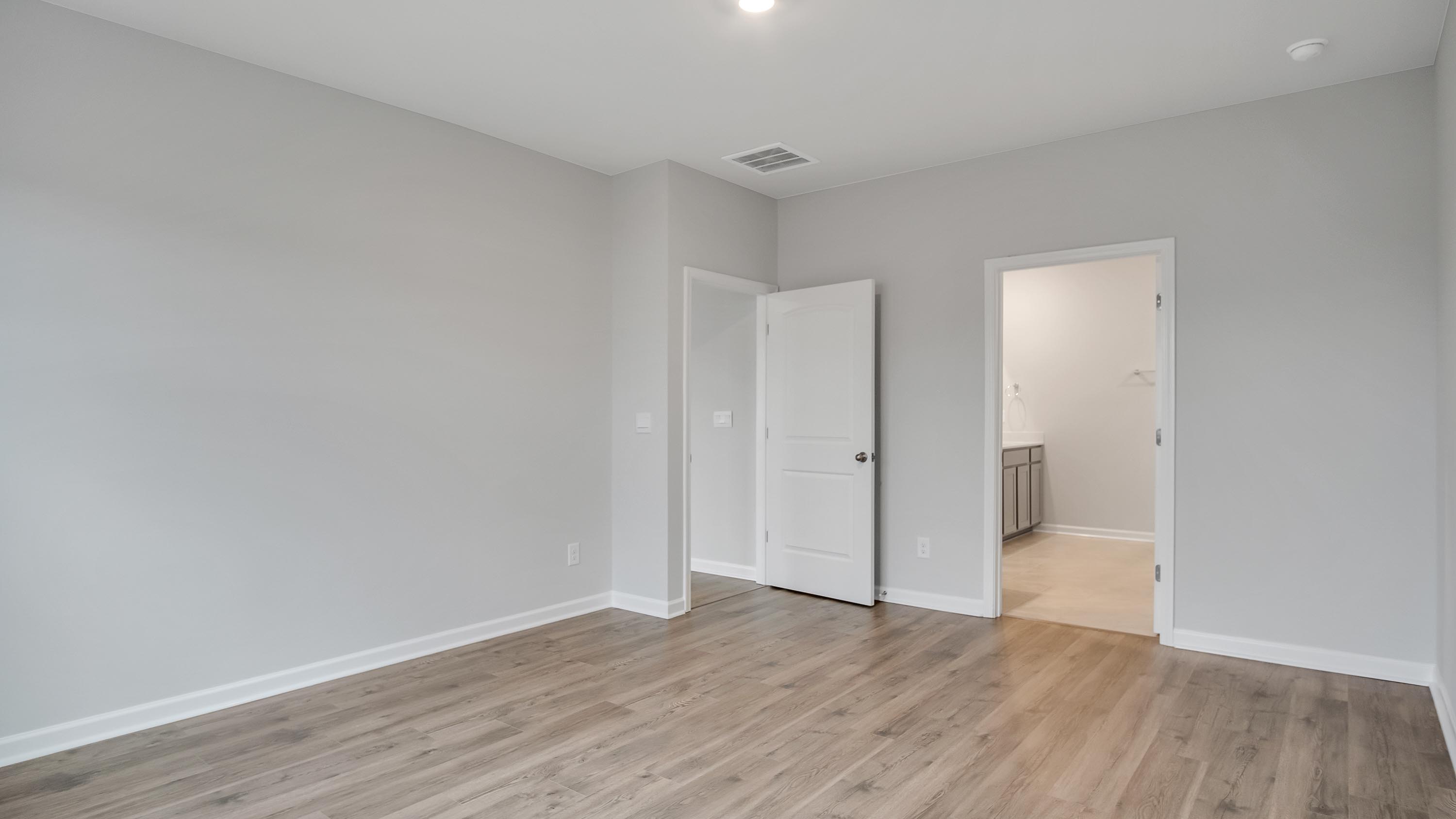 Owner’s suite offers natural window light, spa-inspired ensuite bathroom, backyard view, walk-in closet for everyday style