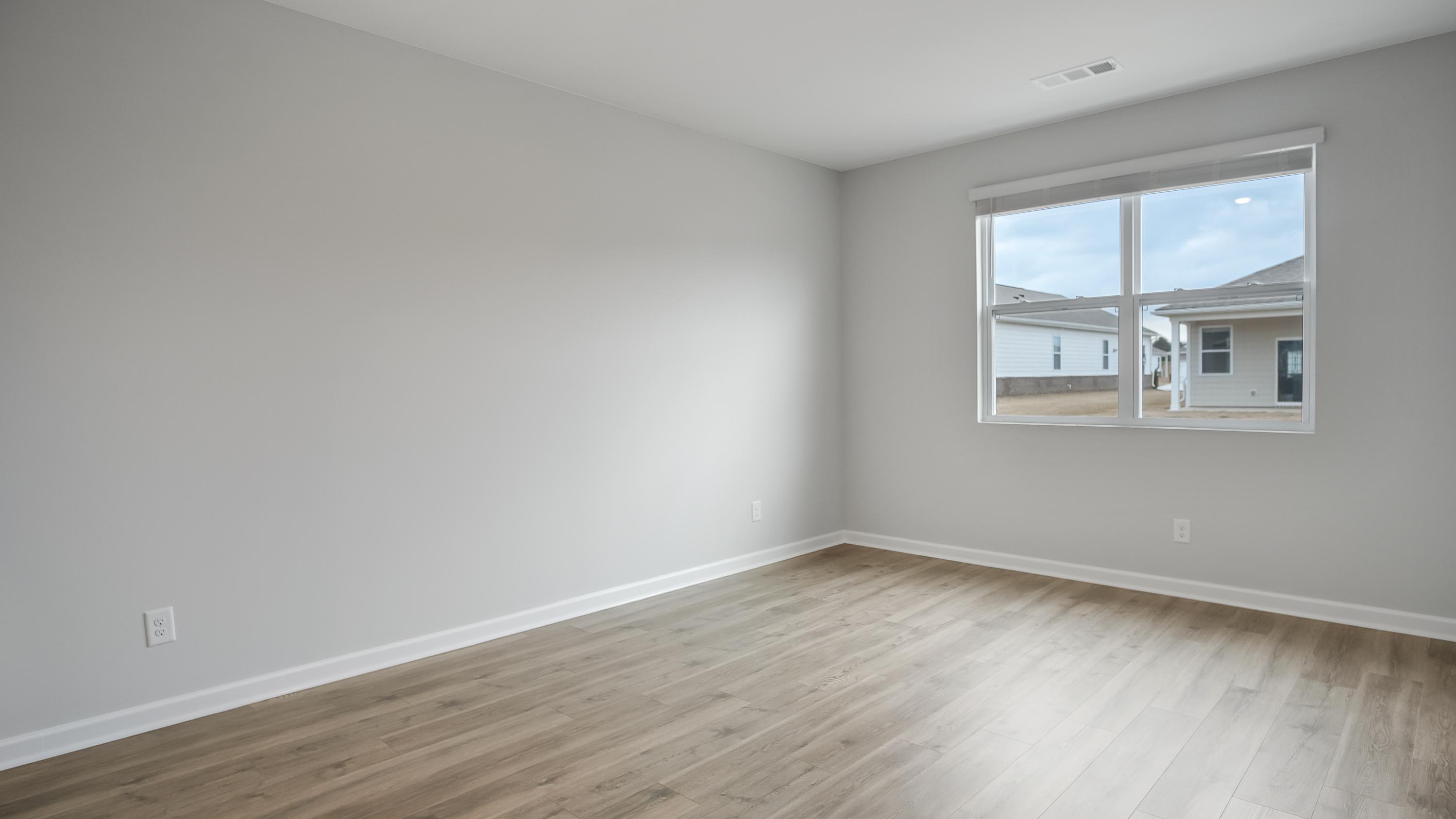 Primary bedroom designed with privacy and space in mind, a flow into a spa-inspired ensuite, walk-in closet on main level
