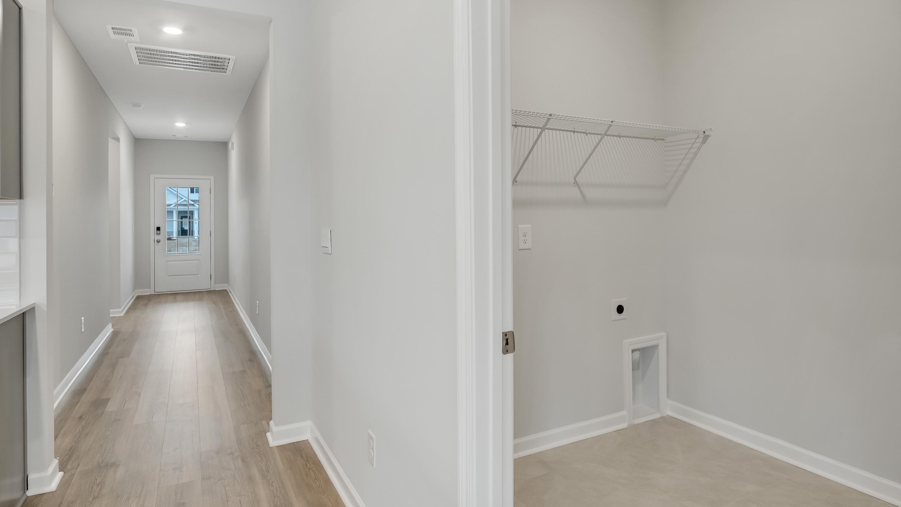 A foyer, entry hall inside front door, next to office, utility room adding a welcoming front, direct line of sight to home