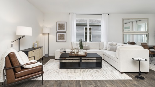 Living room with large window for lighting.