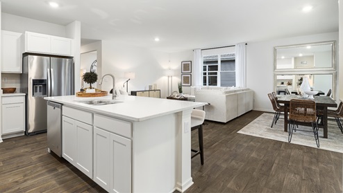 Open concept kitchen with view of living room and dining area.
