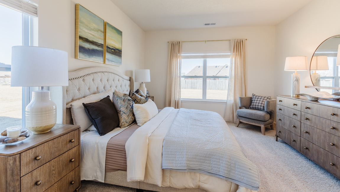 Master bedroom in modern, open concept new build home