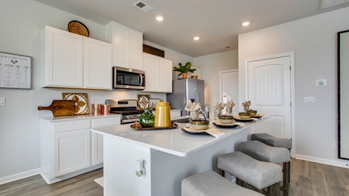Modern kitchen with quartz countertops and stainless steel appliances