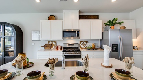 Modern kitchen with quartz countertops and stainless steel appliances