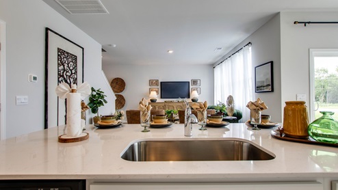 Modern kitchen with quartz countertops and stainless steel appliances