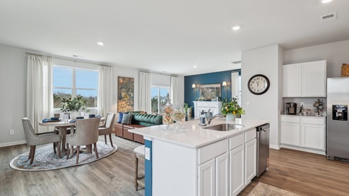 Modern kitchen with quartz countertops and stainless steel appliances