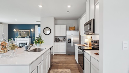Modern kitchen with quartz countertops and stainless steel appliances