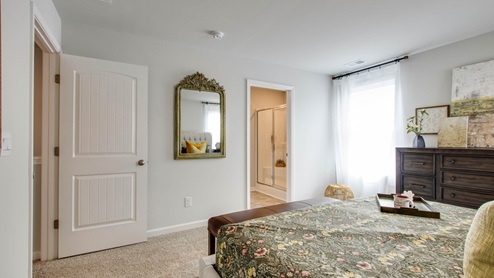 Bedroom in modern, open concept new home