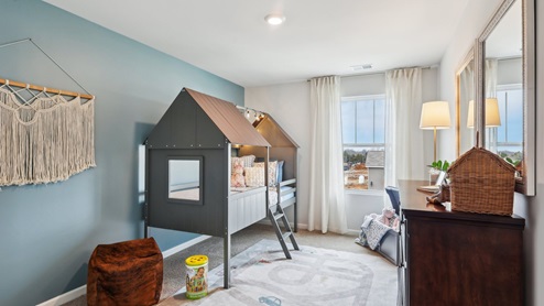 Bedroom in modern, open concept new home