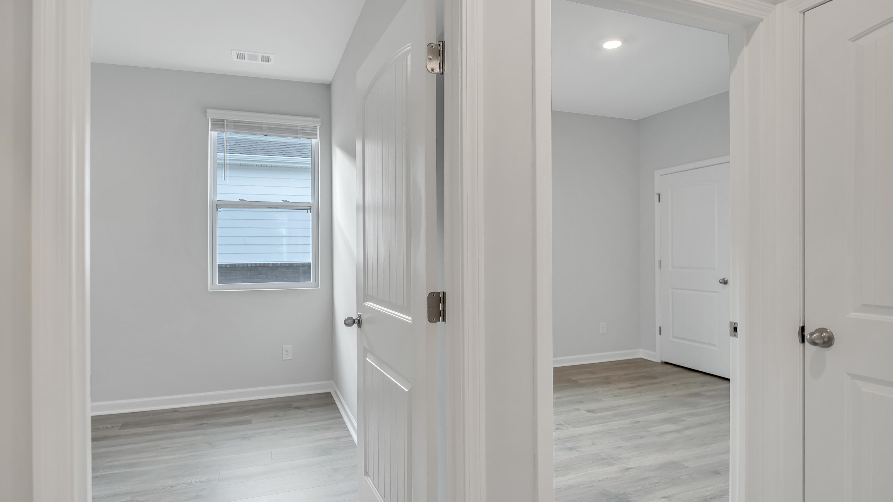 Bedroom in modern, open concept new home