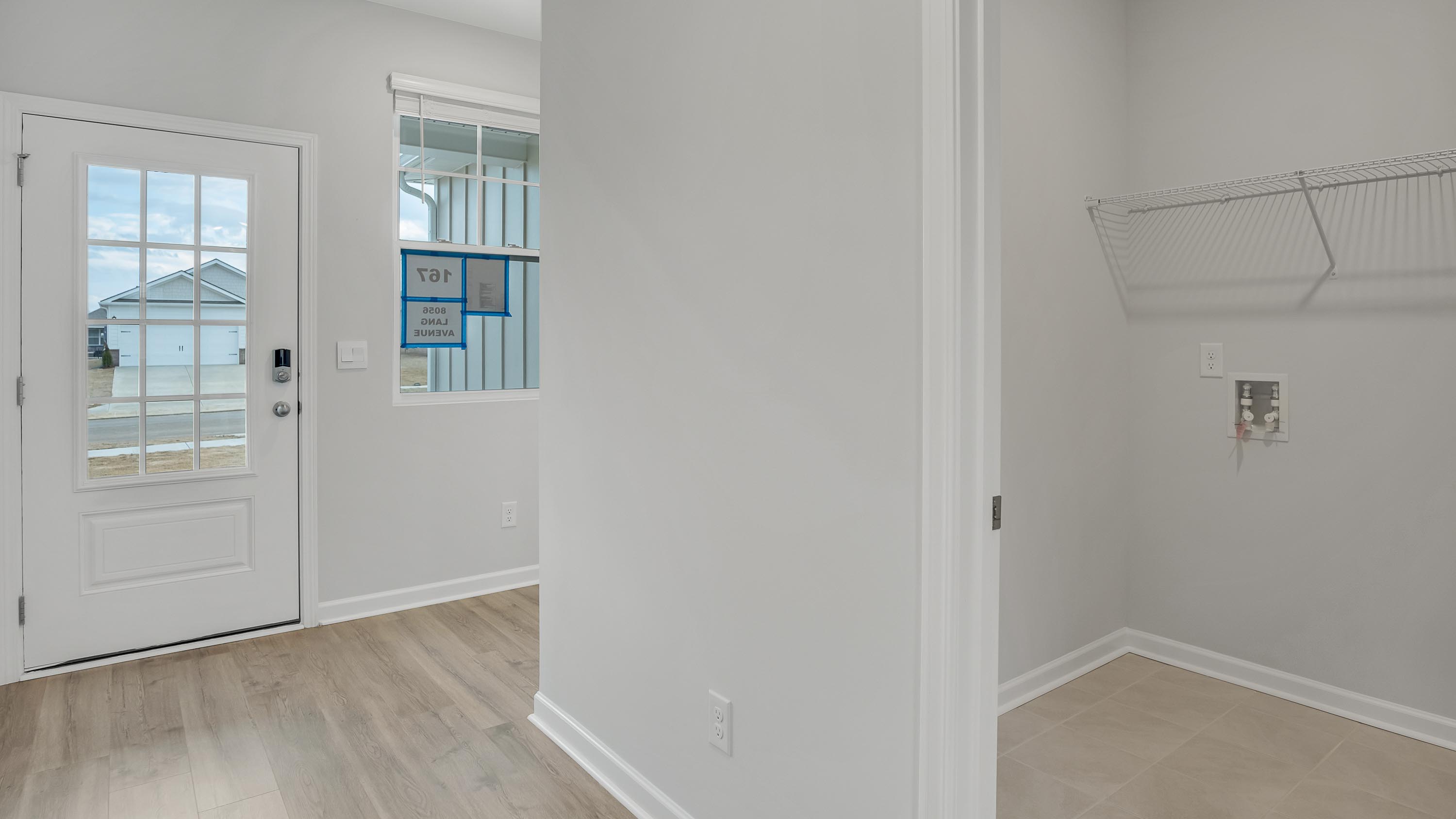 Entry to modern, open concept floorplan